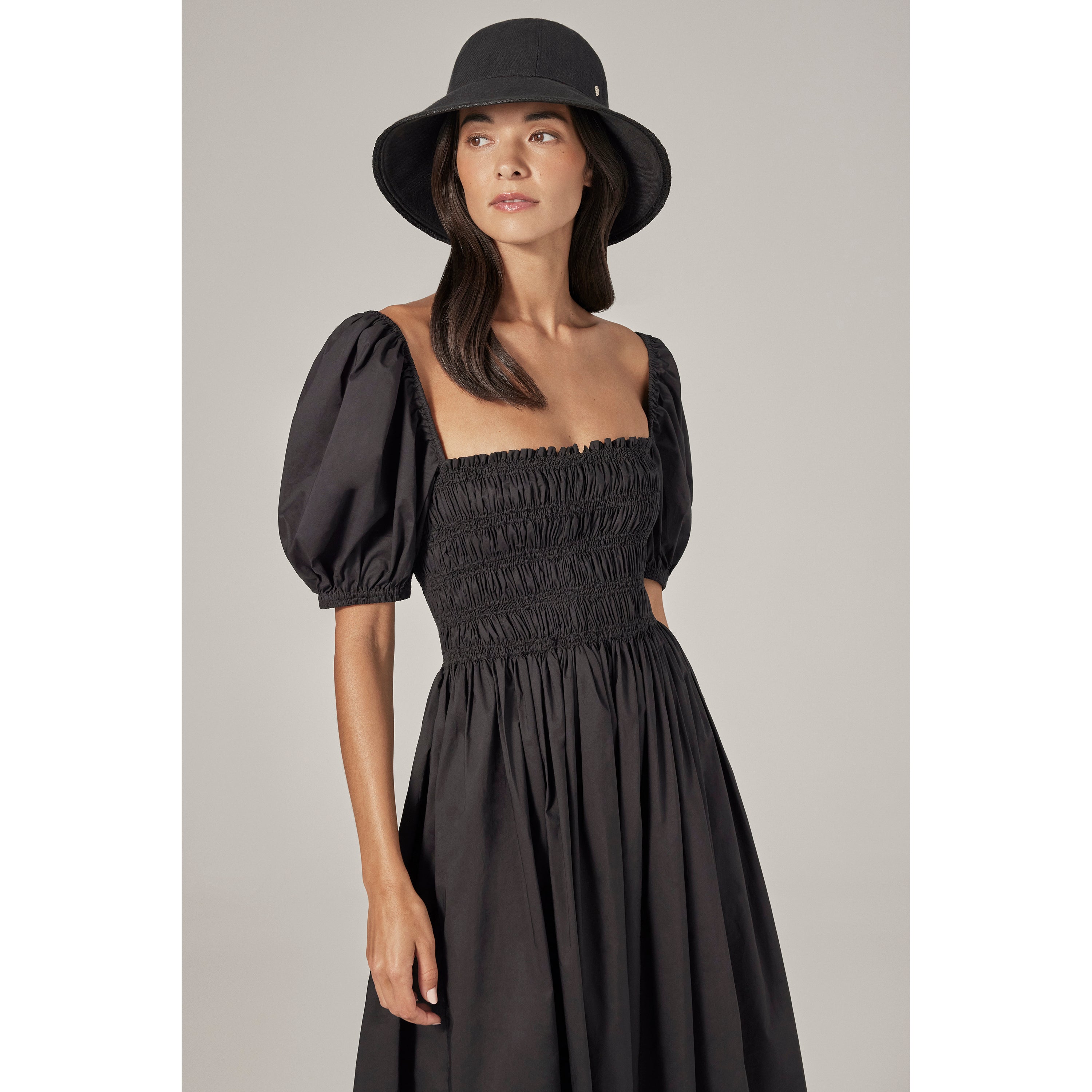 Shop the Lamassu Medium Brim Round Crown Cloche Hat in Black